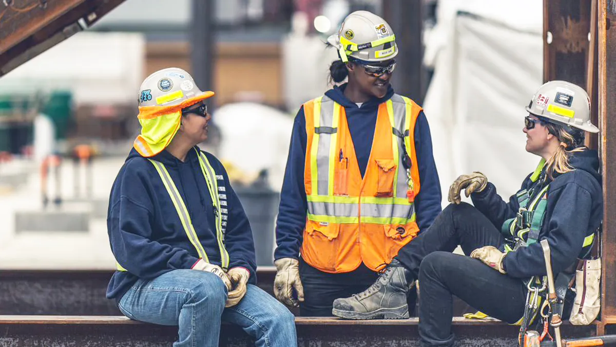 Construction workers chatting on break.