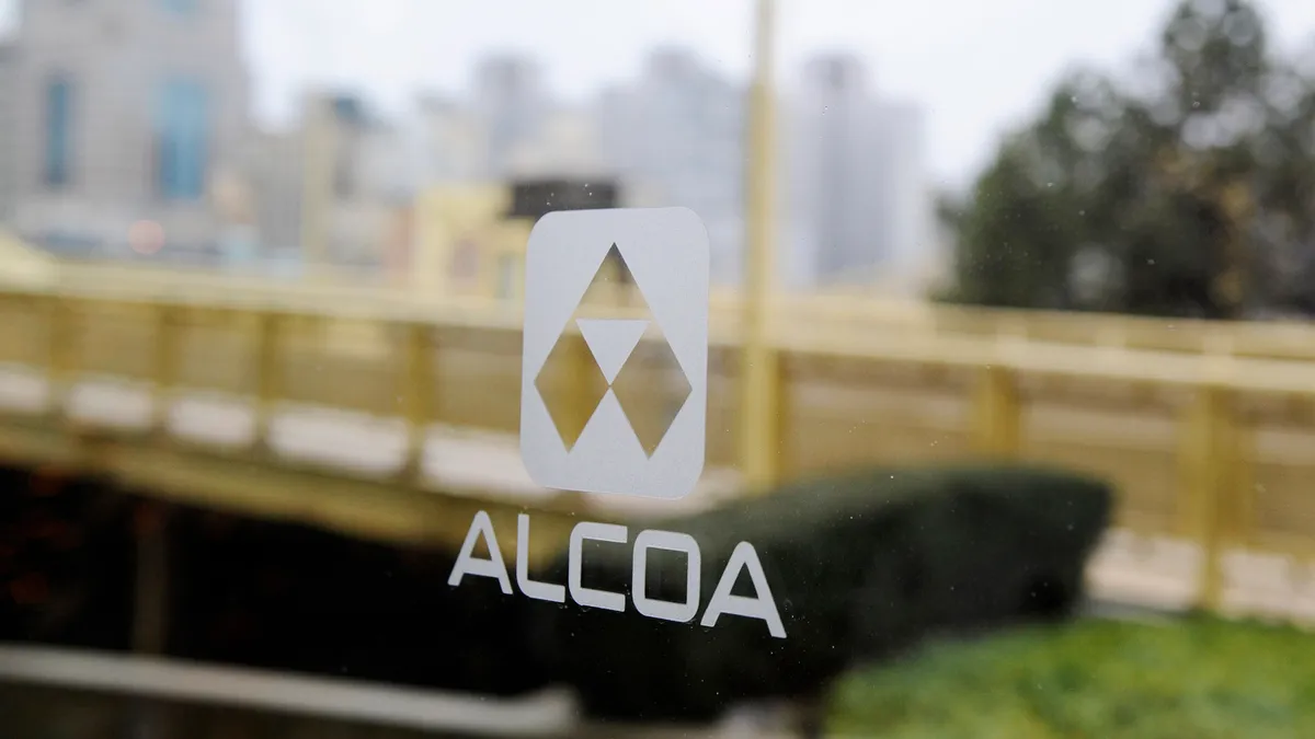 Alcoa logo seen on glass.