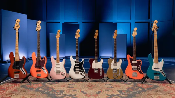 A lineup of Squier electric guitars on display