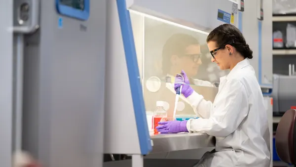 A person works in Sionna Therapeutics' lab.