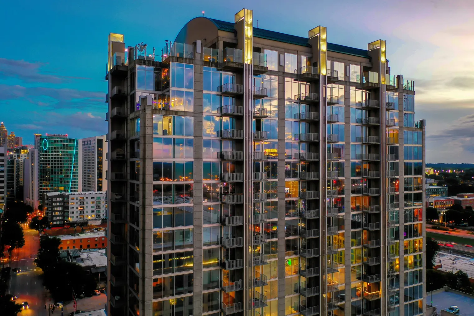 Apartment high-rise with floor-to-ceiling glass units.