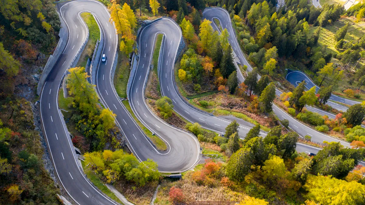 Aerial view of a winding mountain road.