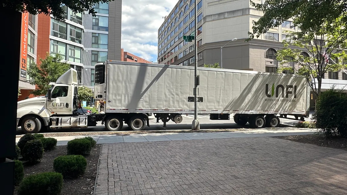 Full UNFI truck parked on the street