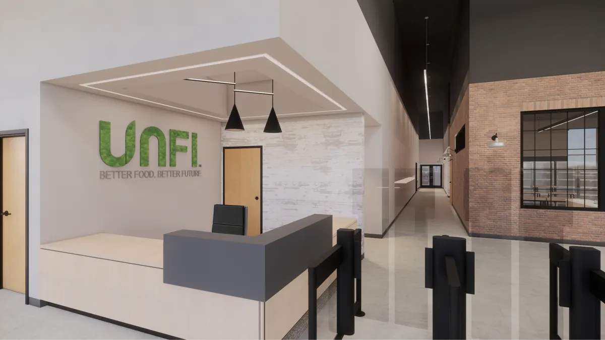 A rendering of the front desk of a warehouse, with a welcome desk on the left side and a room with windows in the back, as well as a hallway.