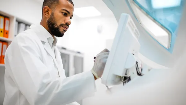 A research scientist is at work in a laboratory setting.
