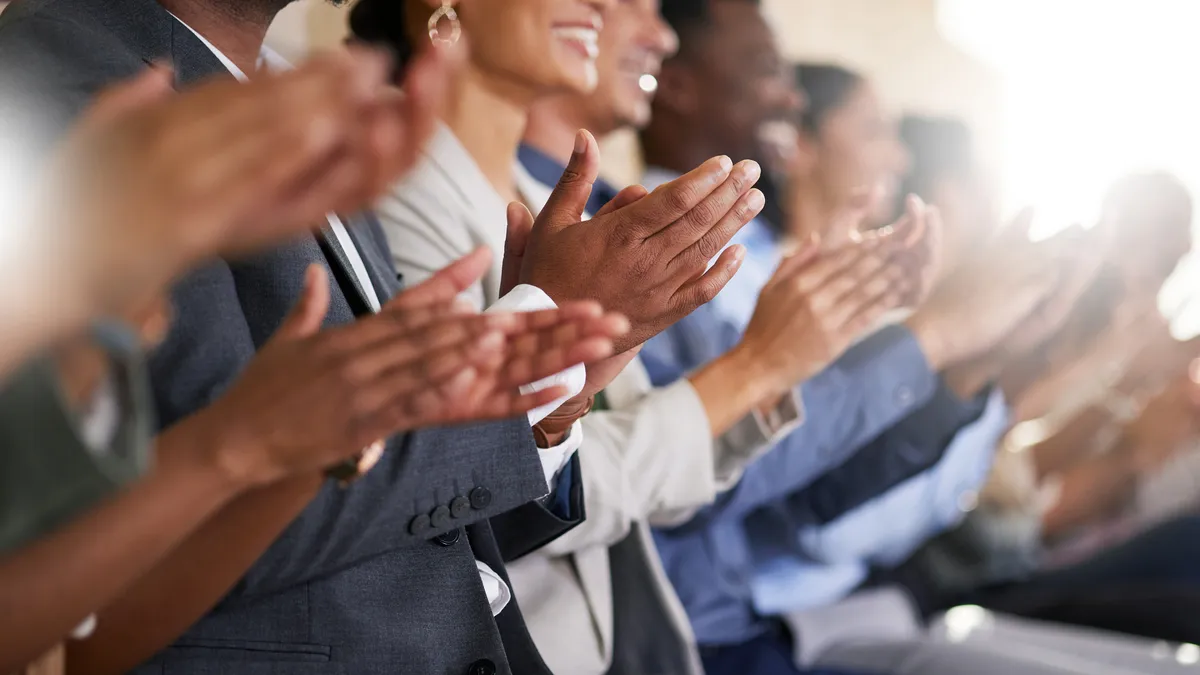 diverse group of business people applauding