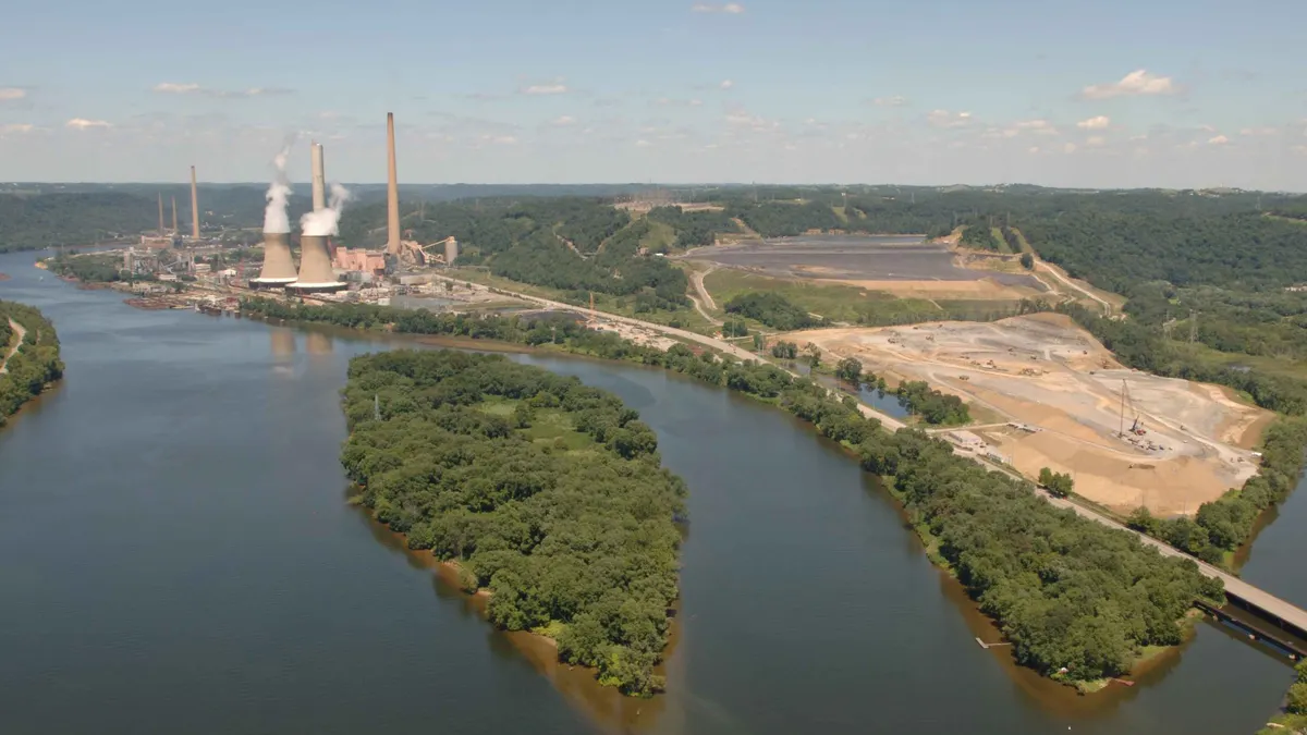 A power plant sits on a bend in a river.