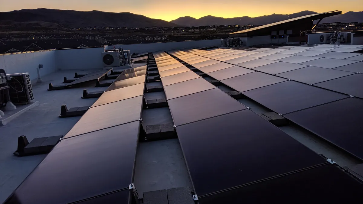 Rooftop solar Utah Virtual power plant with sunset in background over mountain ridge