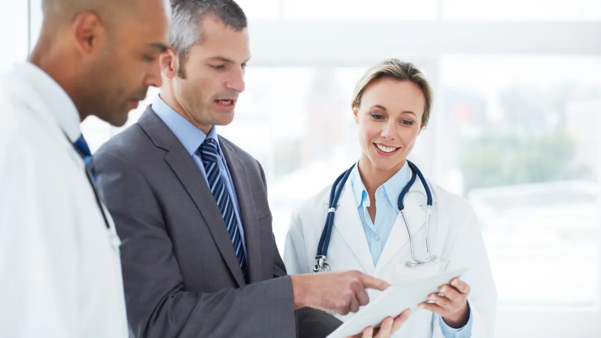 Doctors discussing with a hospital administrator