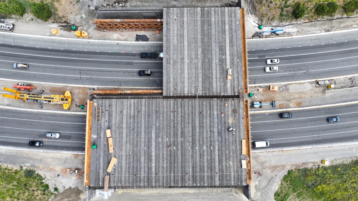 The 165-foot wide crossing, scheduled to be completed in 2026, will blend into the surroundings and allow wildlife to roam above the busy freeway where up to 300,000 vehicles pass daily.