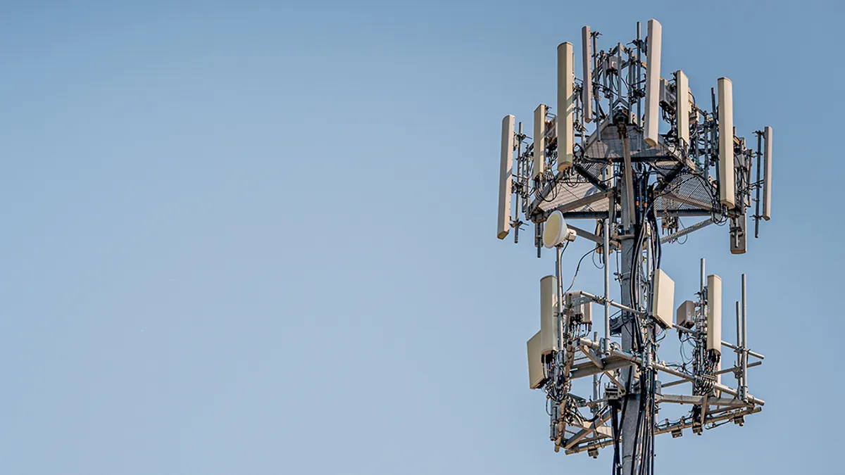 Wireless cellphone tower with blue sky in backrgound