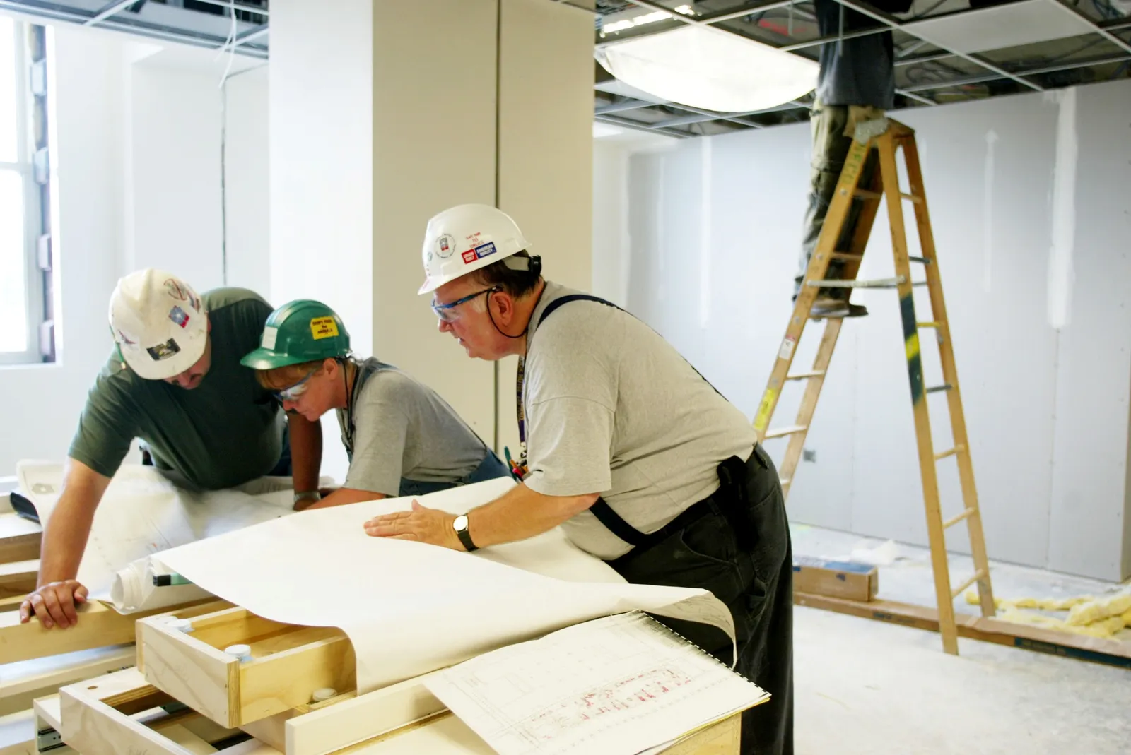 Workers look at blueprints at the Pentagon in Washington, D.C.