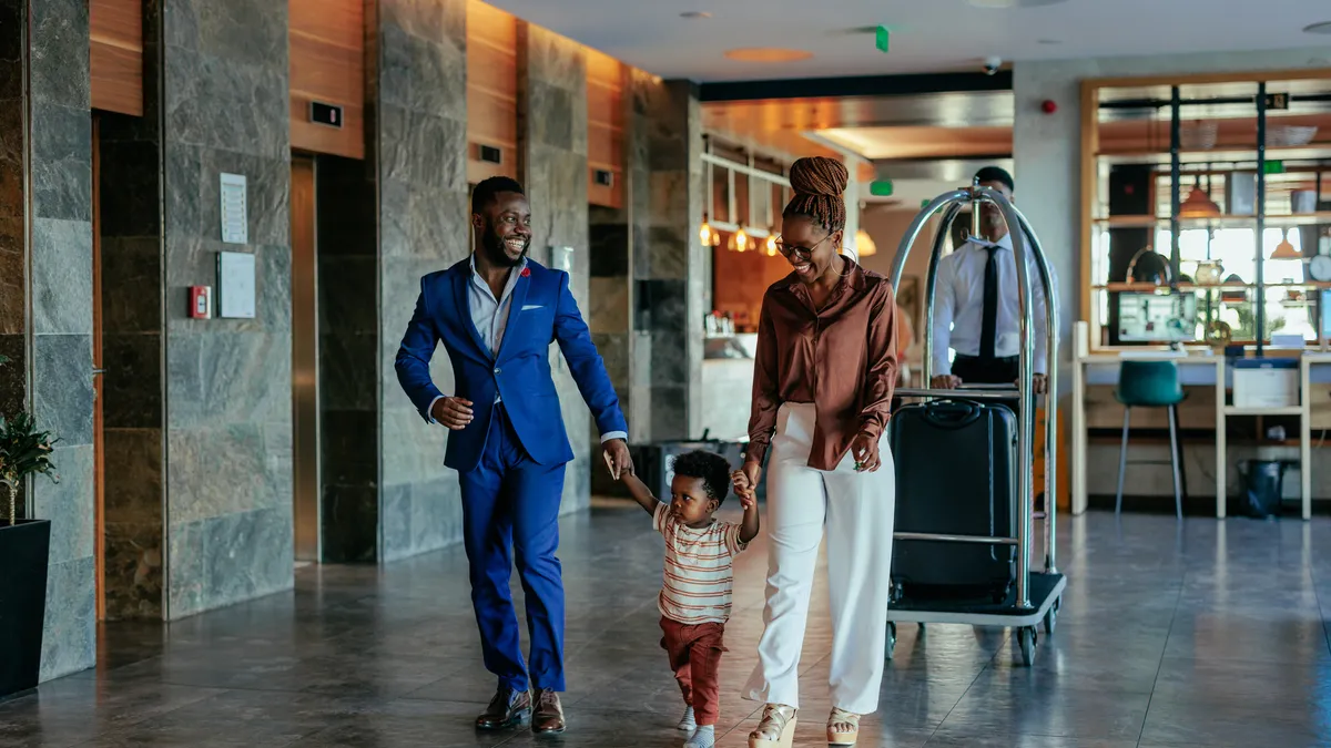 Family walks through hotel