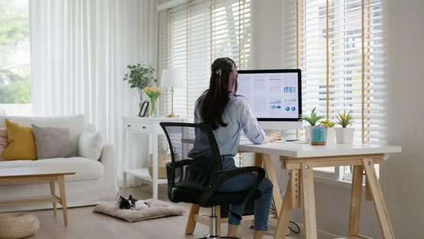 Woman works remotely at home