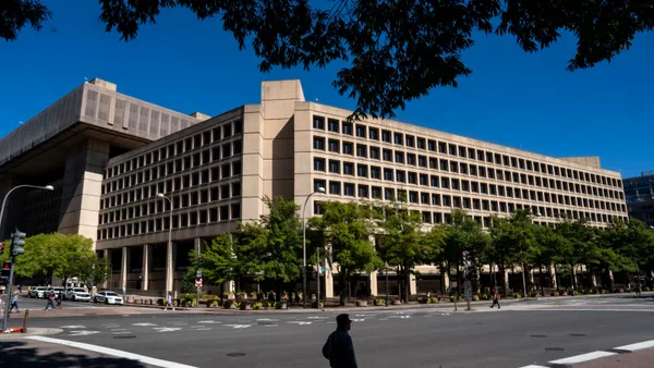 An office building seen from ground level across the street.