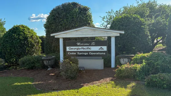 A sign for an industrial facility welcoming visitors to Georgia-Pacific's Cedar Springs containerboard mill.