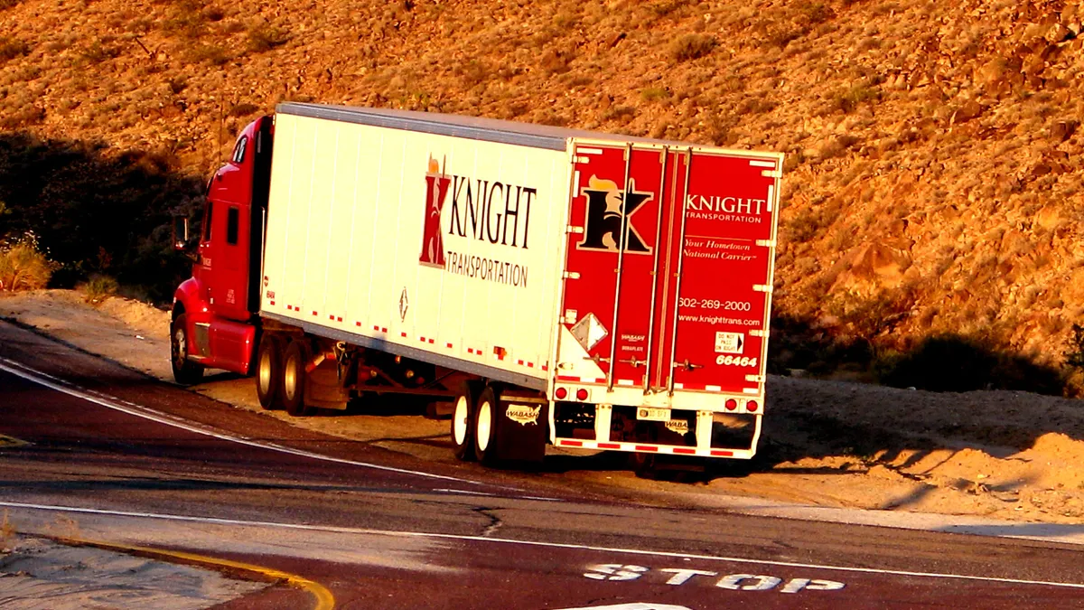 A Knight truck on the side of the road