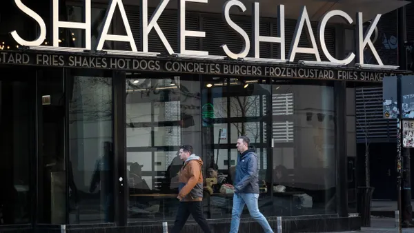 A sign hangs outside of a Shake Shack location on February 21, 2025 in Chicago, Illinois