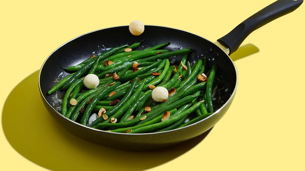 Land O'Lakes Butter Balls in a frying pan of green beans