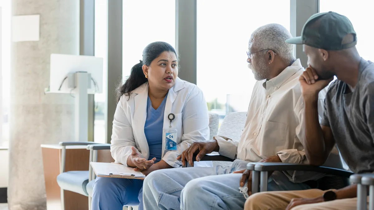 Patient listening to a doctor in waiting room