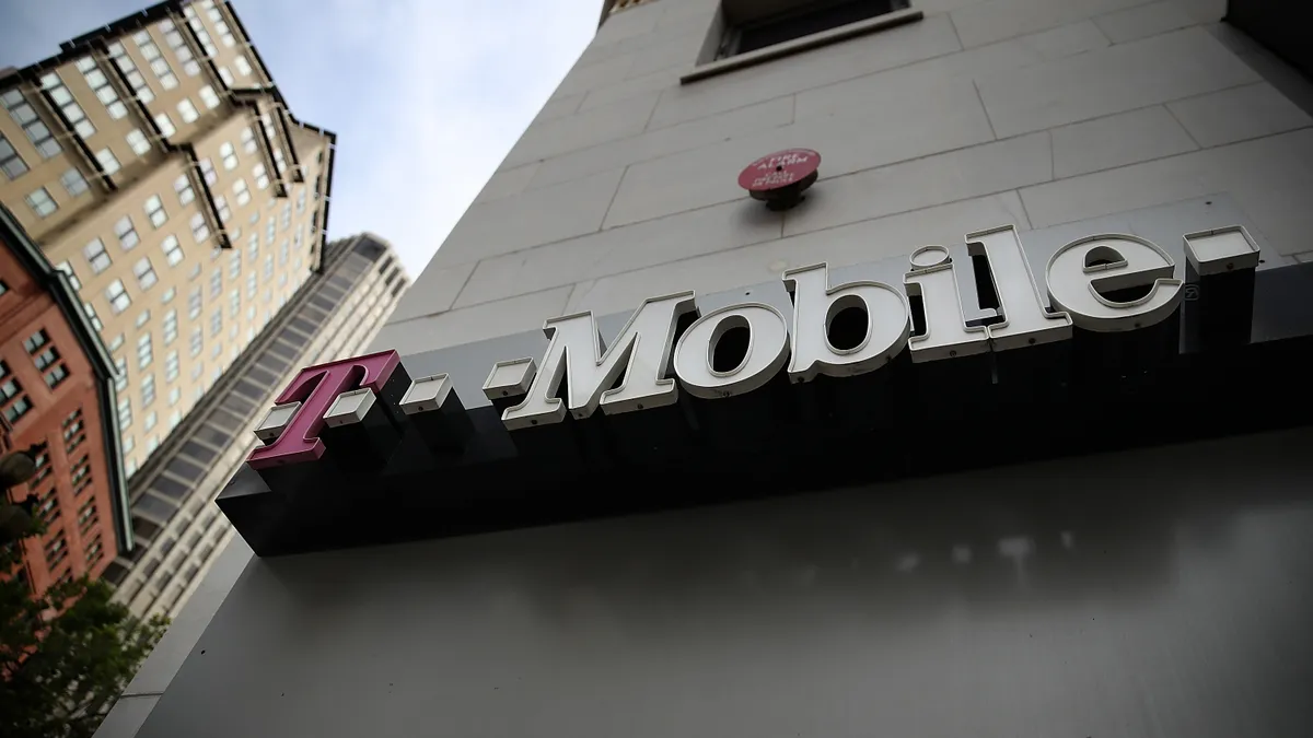 The T-Mobile logo is displayed outside of a T-Mobile store on April 24, 2017 in San Francisco, California.