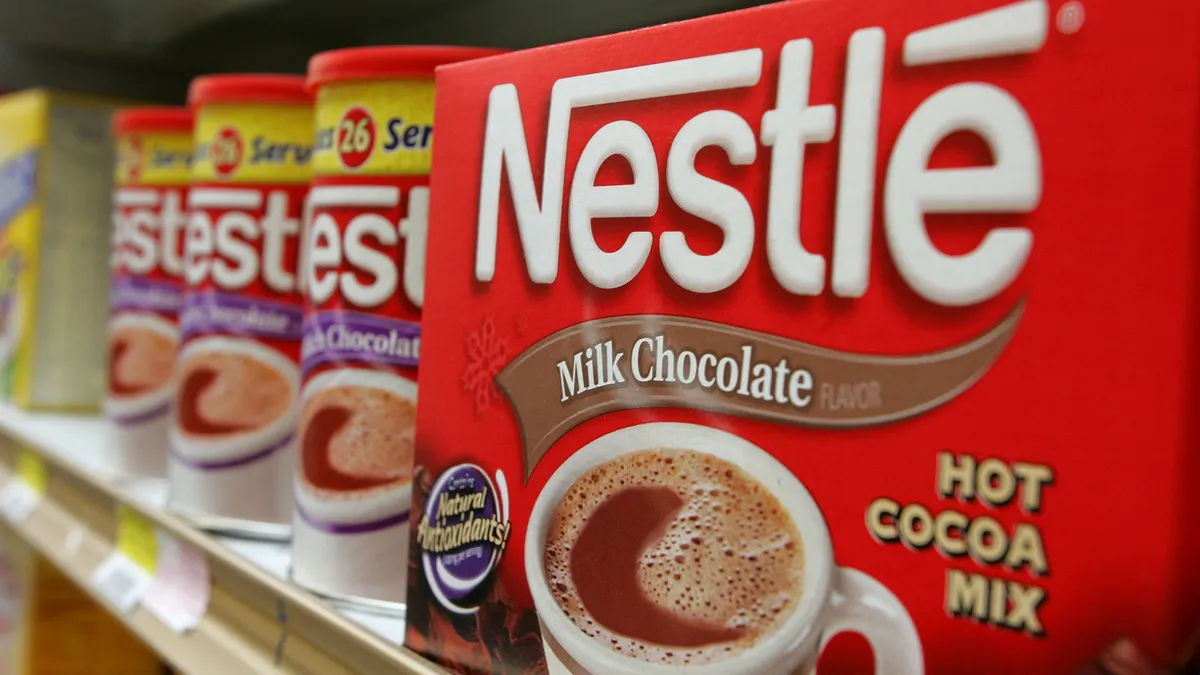 Containers of Nestle hot chocolate mix are seen on a store shelf.