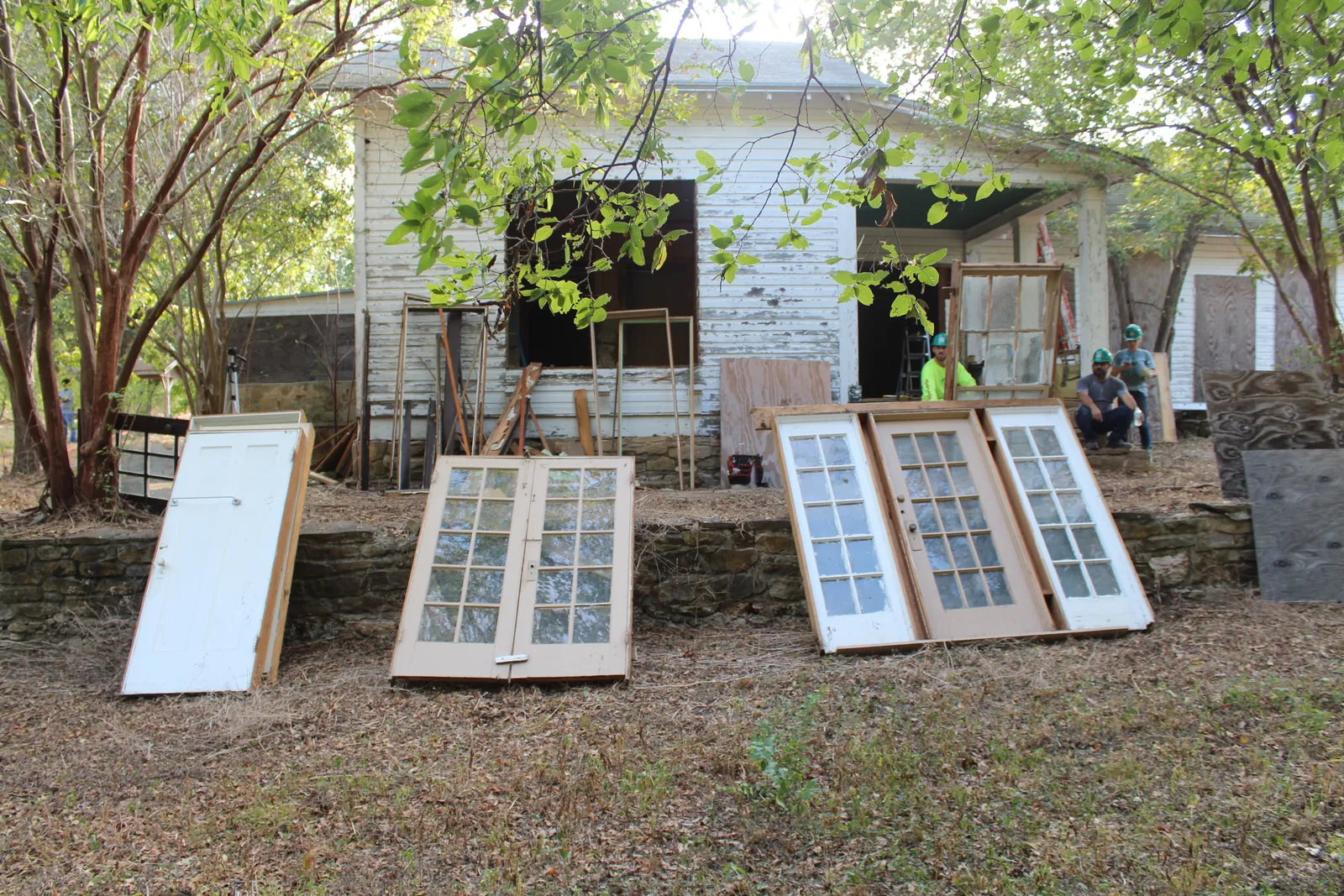 Doors removed from a circa 1920 homestead on the site of deconstruction contractor training in San Antonio.