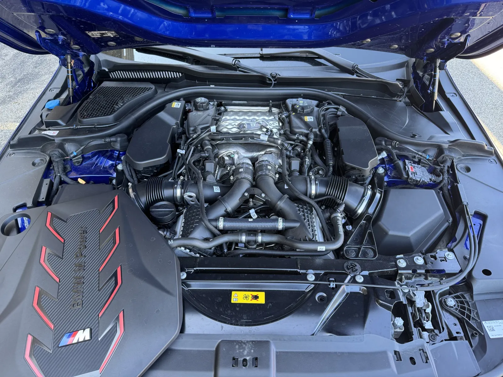 2027 BMW M5 underhood, with plastic engine cover removed
