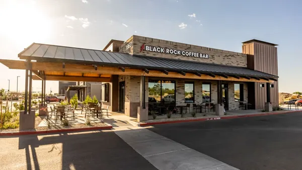An image of a beige brick buidling with a logo that says Black Rock Coffee Bar