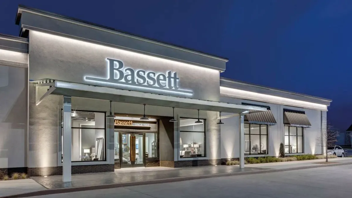 A wide storefront with the Bassett name displayed on the building.