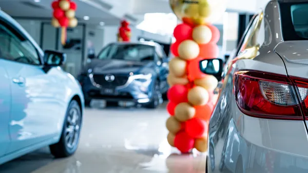 A new car parked in modern showroom.