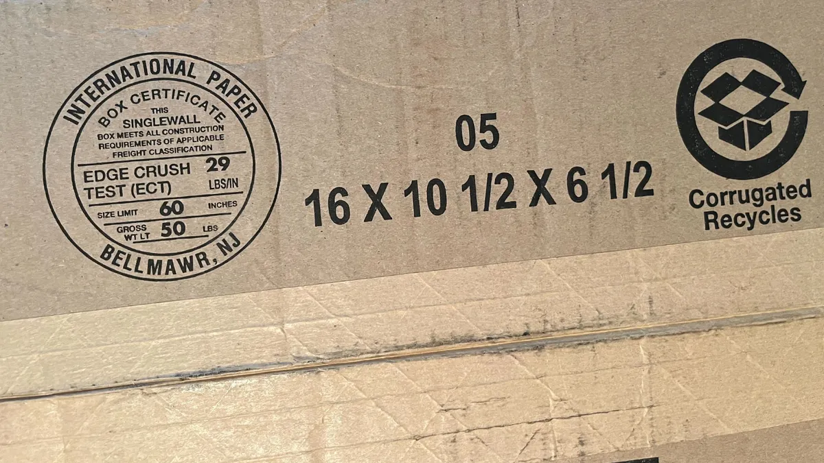 A closeup of the bottom of a corrugated box with International Paper's