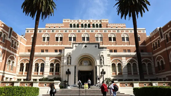 People walk up to a building on the University of Southern California's campus.