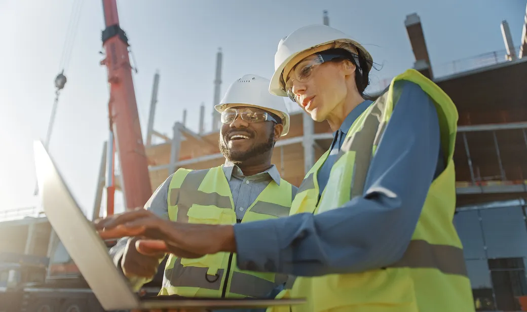 Two Specialists Inspect Commercial, Industrial Building Construction Site