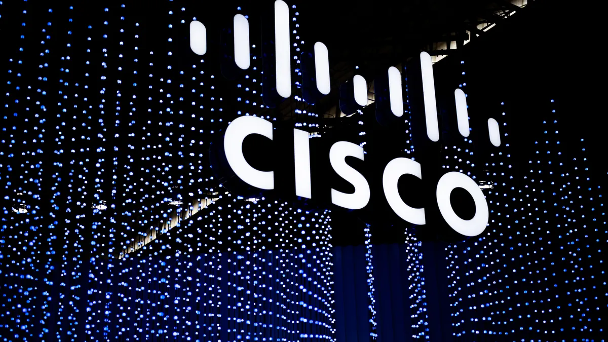 A Cisco logo with blue lights strands in the background.