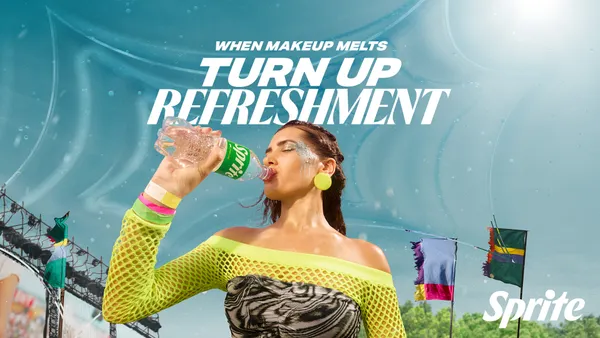 A woman drinks Sprite in music festival attire
