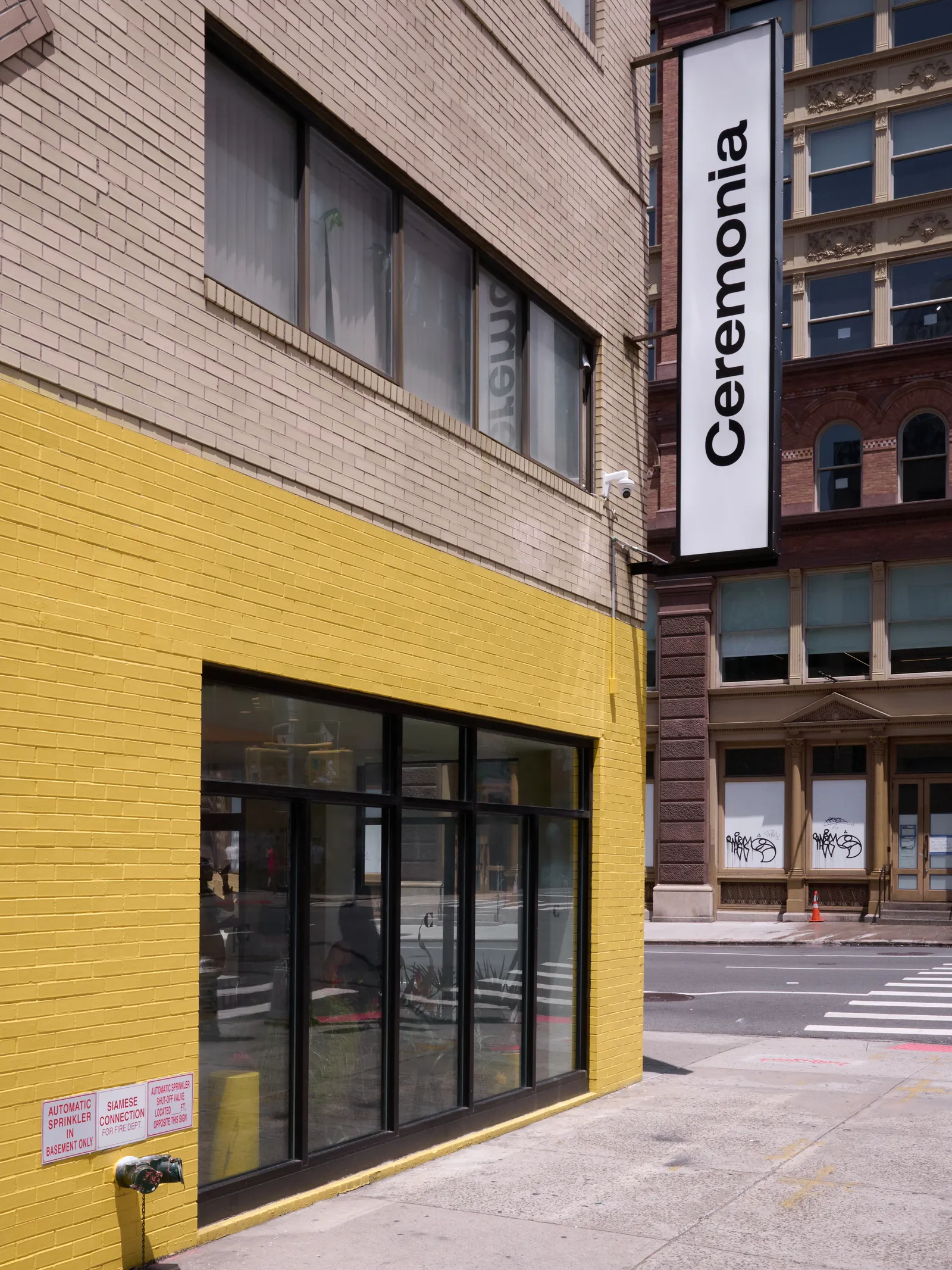 Yellow brick exterior of Ceremonia flagship store in SoHo New York City.