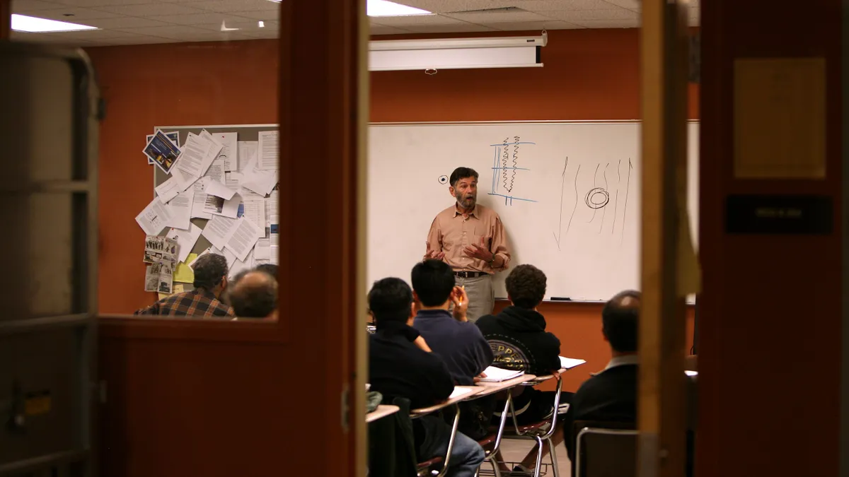 A teacher instructs students on energy systems.