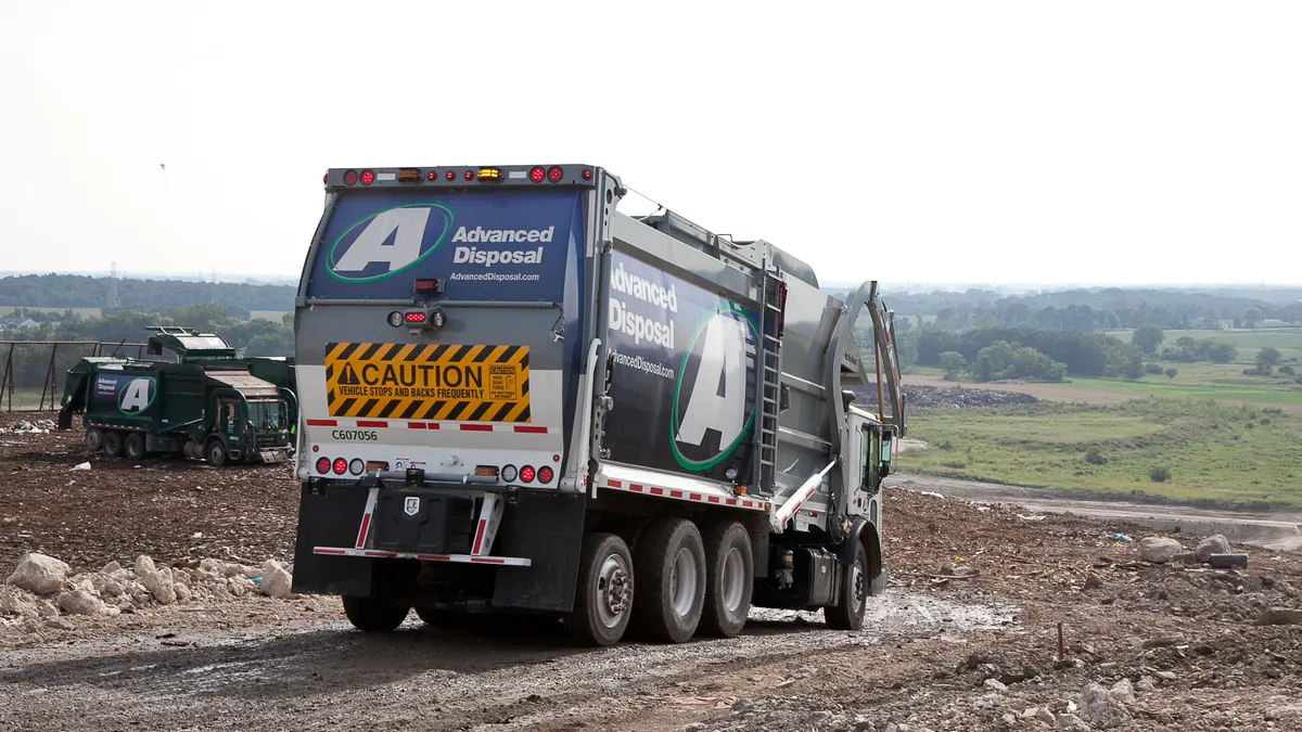 Advanced Disposal Services collection truck on working face of a landfill