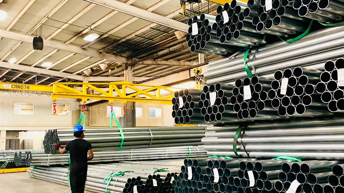 A worker at Nextracker's dedicated MSS Steel Tubes Factory.