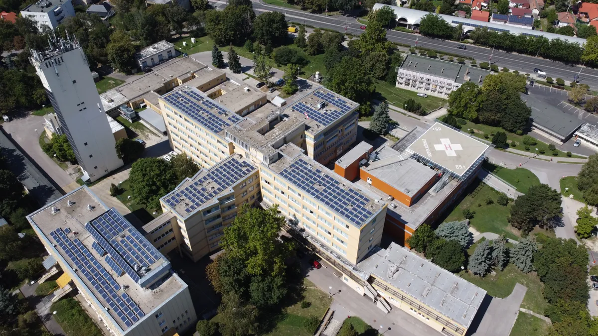 A hospital covered in solar panels.