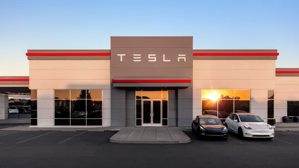 An exterior view of a Tesla showroom.