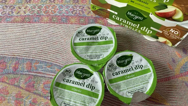 Caramel cups on a table with a brightly colored runner.