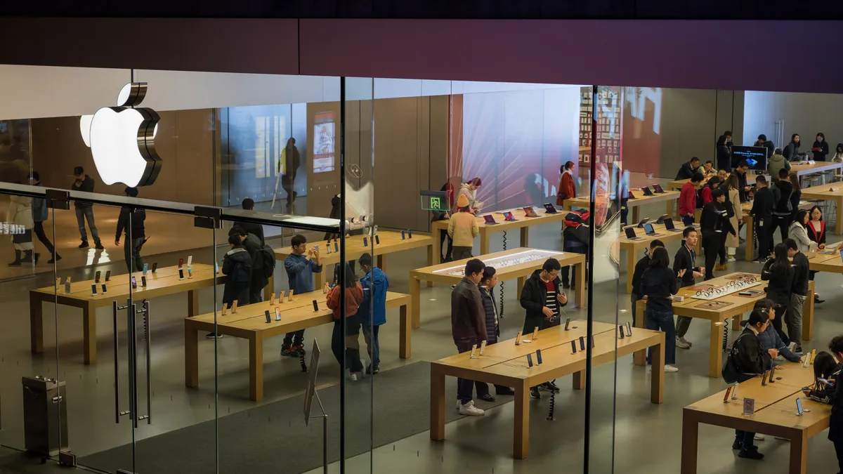 Customers browse inside an Apple Inc. store in on January 3, 2019 in Shenzhen, China.