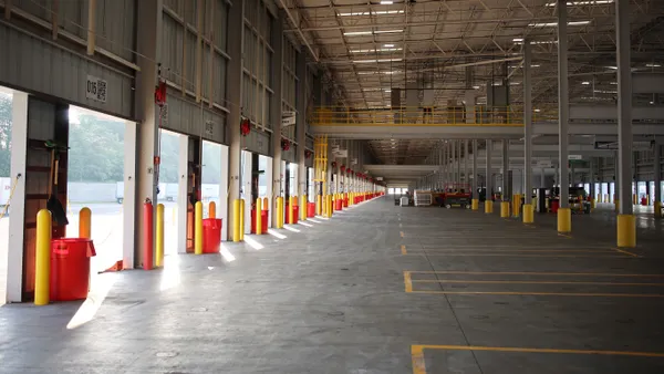 The inside of an updated facility for XPO in Kernersville, North Carolina, with bay areas for loading and unloading freight.