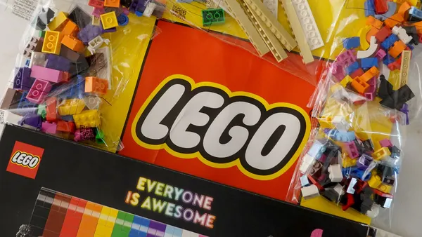 Lego toy bricks seen next to Lego logo.