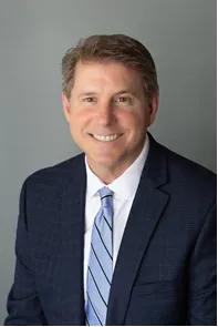 Headshot of man in suit