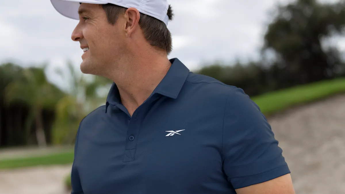 Bryson DeChambeau wearing a Navy polo from Reebok's new golf line