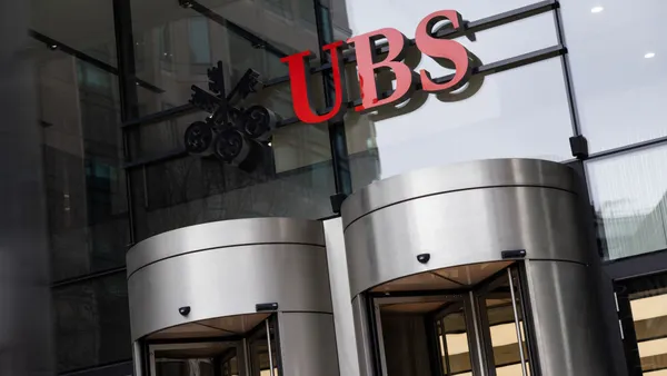 the exterior of an office building bearing UBS signage