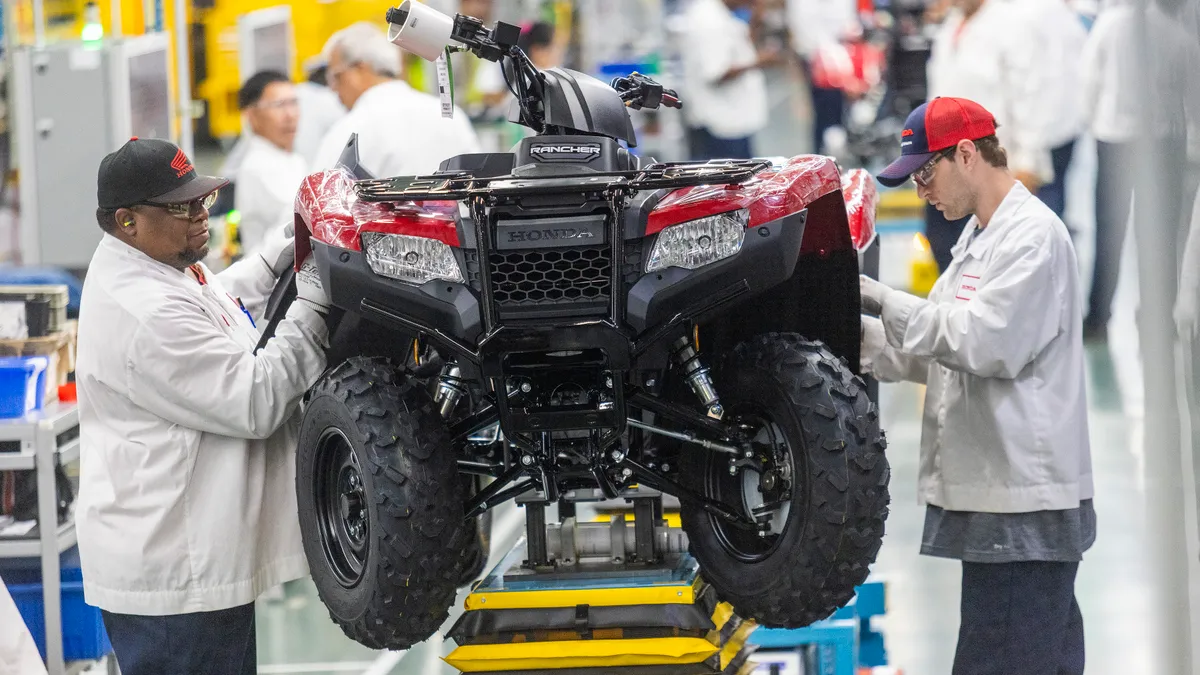 Workers assemble an ATV at Honda's Swepsonville, North Carolina, facility.